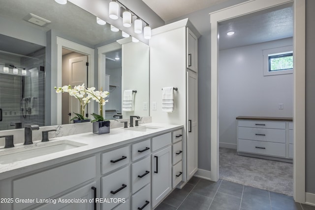 6119 Fresno Ln, East Lansing, MI 48823 - full bath with double vanity, tile patterned flooring, and a stall shower