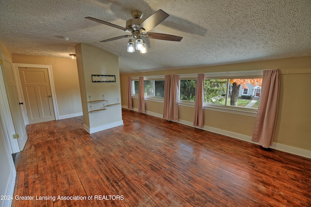 interior space with ceiling fan, a textured ceiling, and dark hardwood / wood-style flooring