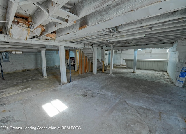 520 W St, Lansing, MI 48915 - unfinished below grade area featuring stairs and electric panel