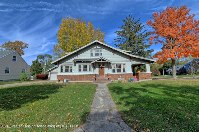 view of front facade with covered porch and a front lawn