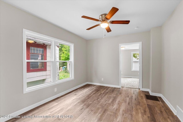 unfurnished room featuring ceiling fan and light hardwood / wood-style flooring