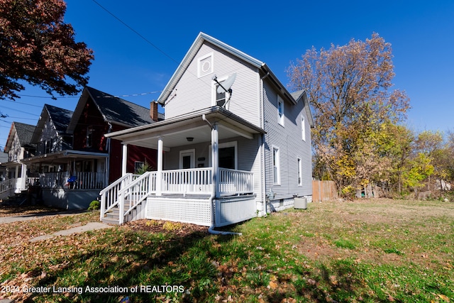 view of front of house with a front lawn and a porch