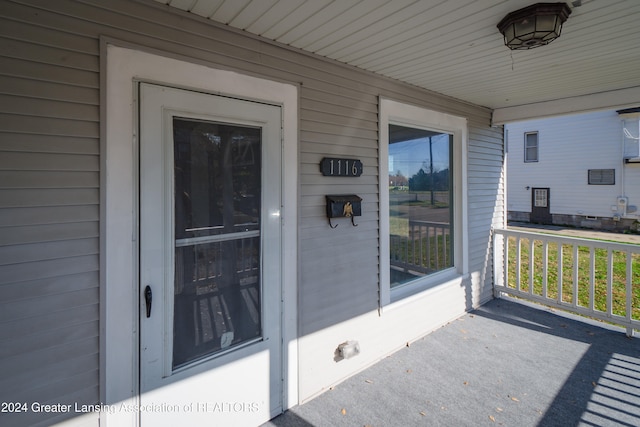 entrance to property featuring a porch