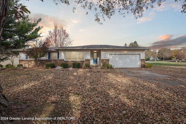 single story home featuring a garage