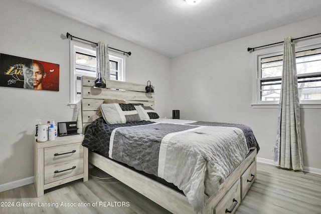 bedroom with light hardwood / wood-style floors