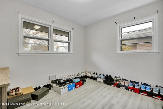 workout room with wood-type flooring