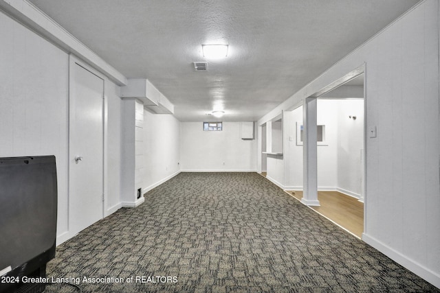 basement with a textured ceiling