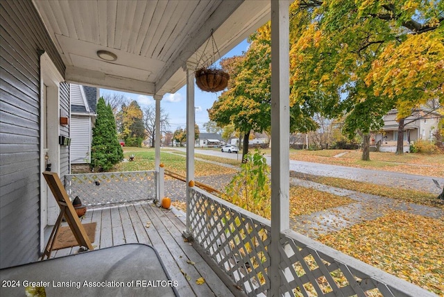 wooden terrace with a porch