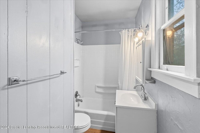 full bathroom with vanity, toilet, and shower / tub combo