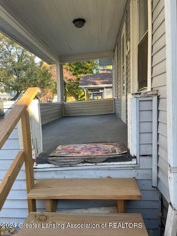 wooden deck with a porch