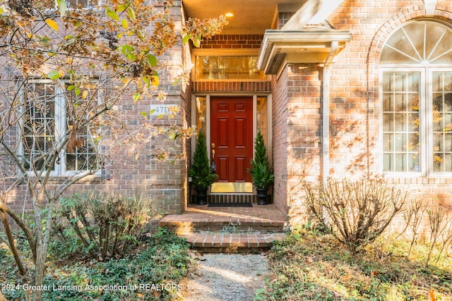 4710 Wellington Dr, Okemos, MI 48864 - doorway to property featuring brick siding