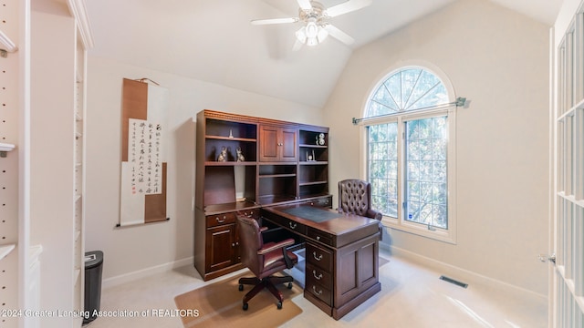 carpeted office with ceiling fan, plenty of natural light, and lofted ceiling