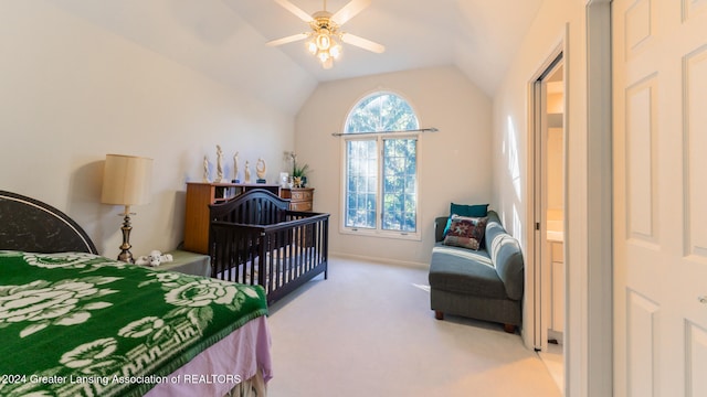 carpeted bedroom with ceiling fan, multiple windows, and vaulted ceiling