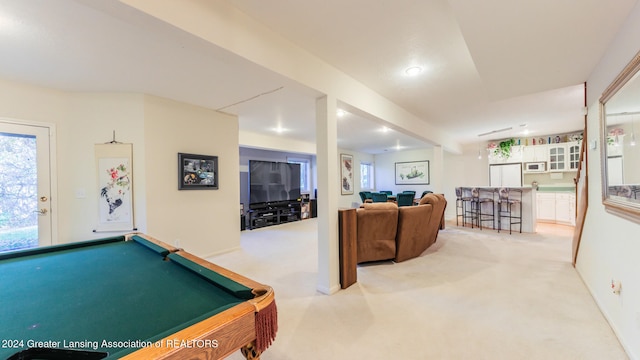 recreation room with light colored carpet and pool table