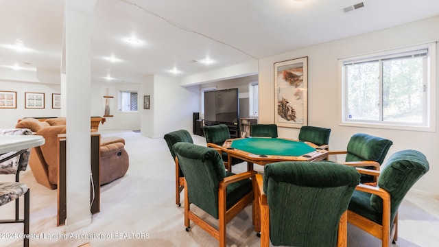 game room with light colored carpet