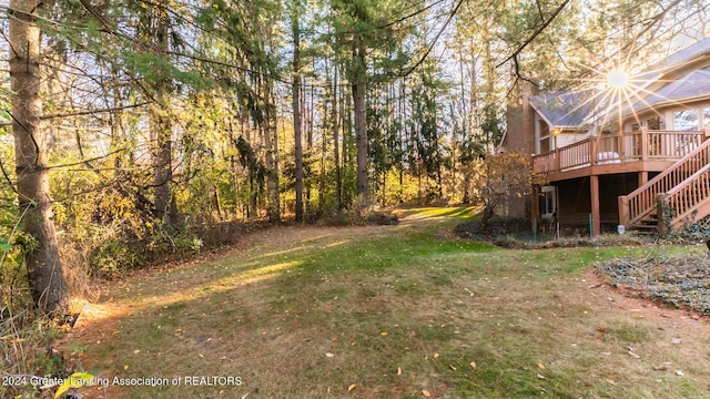 4710 Wellington Dr, Okemos, MI 48864 - view of green lawn featuring a deck and stairs