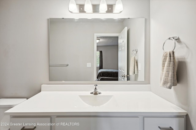 bathroom with vanity and toilet