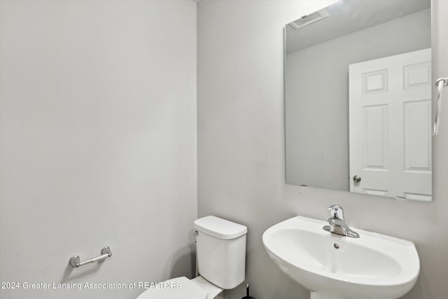 bathroom with toilet and sink