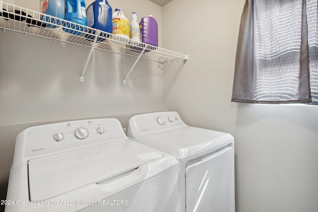 clothes washing area featuring washing machine and clothes dryer