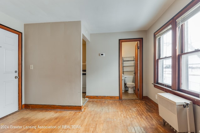 interior space featuring plenty of natural light, light wood-type flooring, and radiator