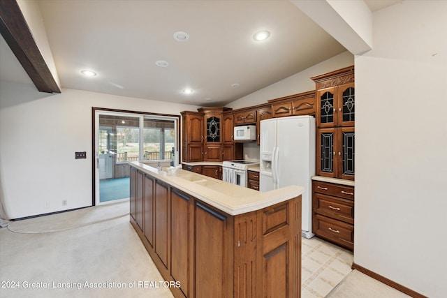 kitchen featuring white appliances, vaulted ceiling, light colored carpet, and a center island with sink