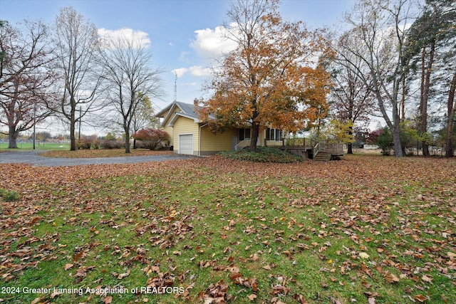 view of yard featuring a garage