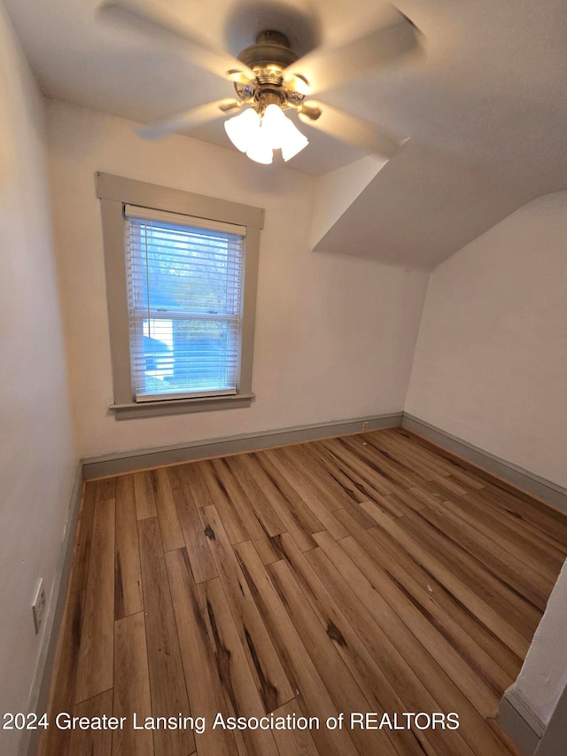 additional living space featuring hardwood / wood-style floors and ceiling fan