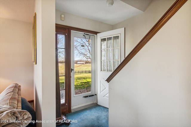 view of carpeted entrance foyer