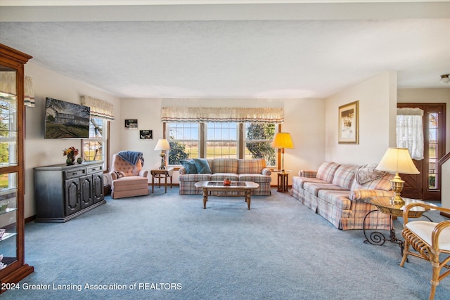 carpeted living room with a textured ceiling