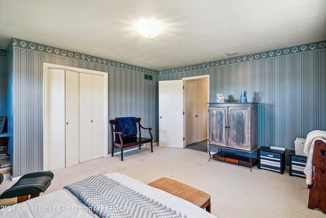 carpeted bedroom with a closet