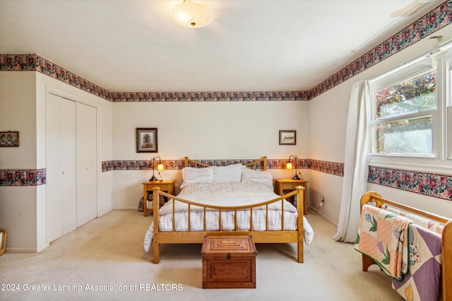 bedroom with a closet and carpet floors