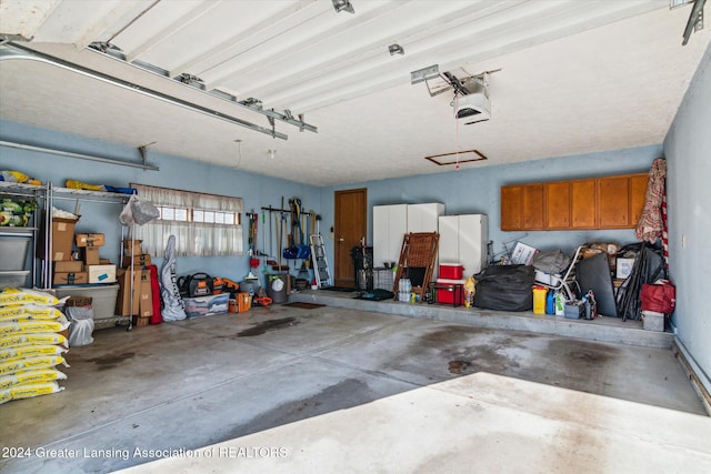 garage featuring a garage door opener