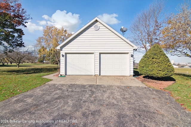 garage with a yard