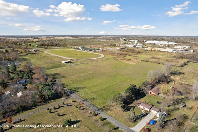 birds eye view of property featuring a rural view