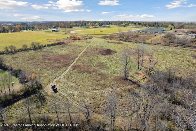 birds eye view of property with a rural view