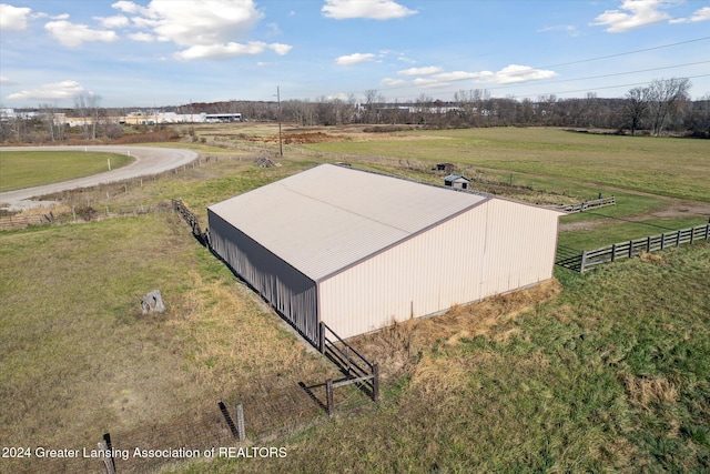 exterior space with a rural view and a lawn