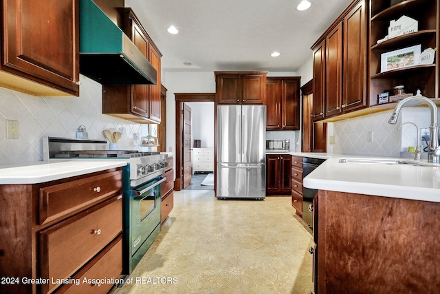 kitchen featuring backsplash, extractor fan, sink, and appliances with stainless steel finishes