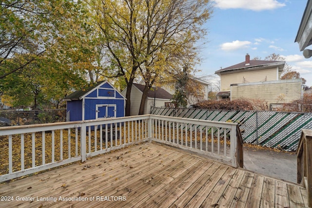 wooden deck featuring a storage shed