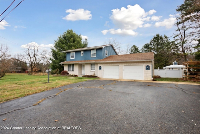 front facade with a front lawn and a garage