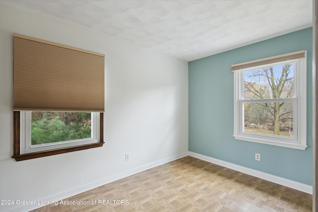 spare room featuring light parquet floors