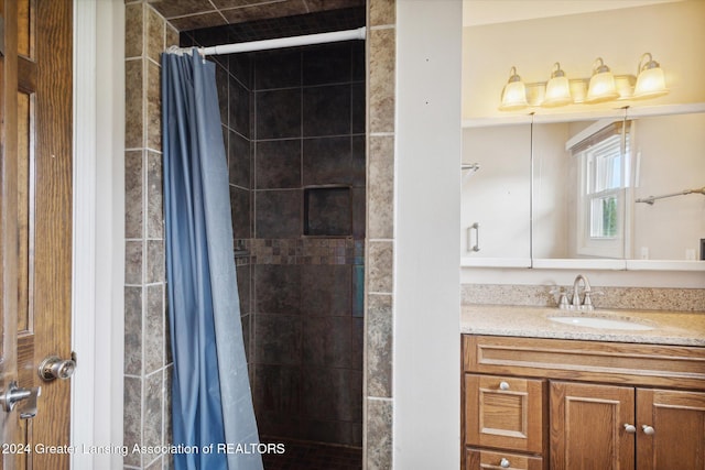 bathroom with vanity and curtained shower