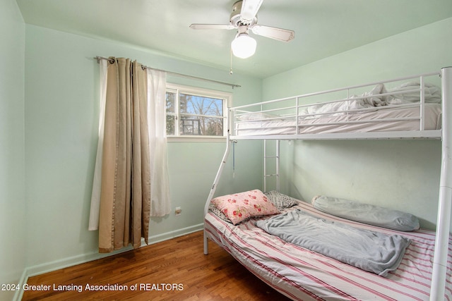 bedroom featuring ceiling fan and wood-type flooring