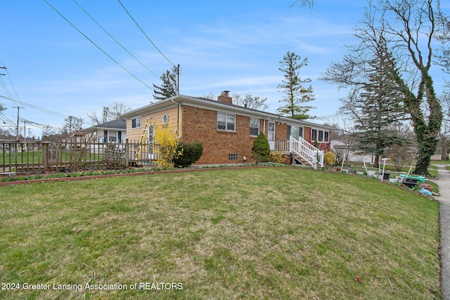 view of front of property with a front lawn