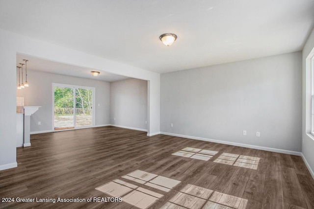 spare room with dark hardwood / wood-style floors