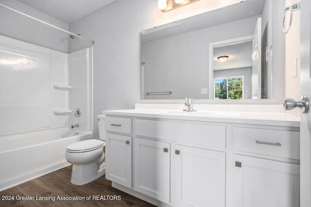 full bathroom featuring wood-type flooring, vanity, toilet, and bathtub / shower combination