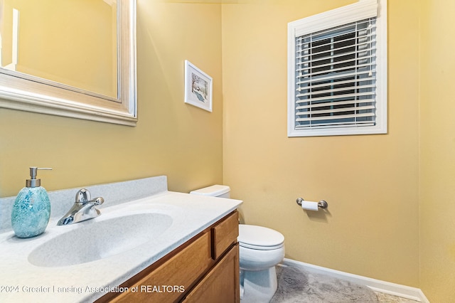 bathroom with vanity and toilet