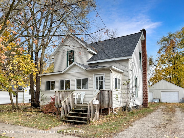 view of front facade featuring an outbuilding and a garage