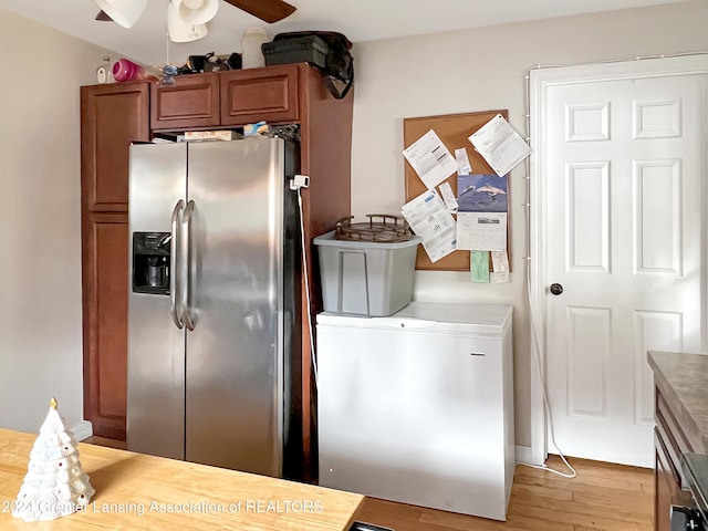 interior space with ceiling fan and light hardwood / wood-style flooring