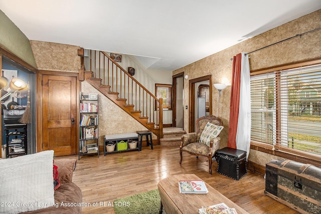 223 S Pennsylvania Ave, Lansing, MI 48912 - living room with light wood-style flooring and stairway