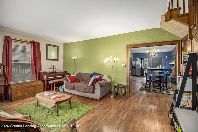 223 S Pennsylvania Ave, Lansing, MI 48912 - living room featuring a chandelier and wood-type flooring